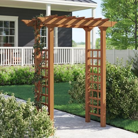 Frame a walkway or spruce up a garden space with this classic arbor. Designed to mimic the look of wood without the maintenance, this clean-lined design is crafted from composite vinyl in a warm walnut brown finish to resist cracking, rotting, UV, mildew, warping, and weather. Plus, the manufacturer backs this product with a 10-year warranty. Mounting stakes are included to secure this design into your yard. Garden Kaleidoscope, Guess House, Arbor Gate, New England Arbors, Wood Arbor, Wooden Arbor, Garden Arch Trellis, Gazebo Ideas, Trellis Ideas