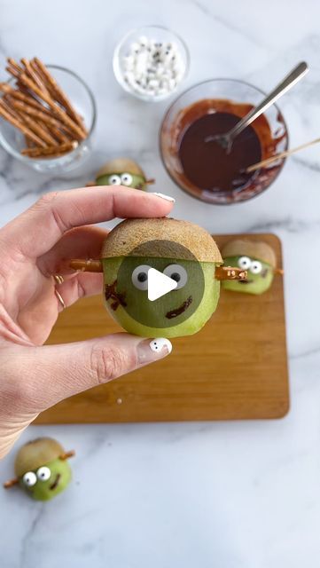 Alaura Berry on Instagram: "Kiwi Frankenstein Cuties 🥝🧟‍♂️

Another fun addition to a cheese board or kids snack plate for Spooky Szn 👻

All you need is:
〰️Kiwis cut in half
〰️@snyders_hanover pretzel sticks 
〰️Melted dark chocolate 
〰️Candy eyes 
And a potato peeler for peeling your kiwi to create the hat!

I would recommend making these and using them right away. They do not store well because of the kiwis and tend to melt a little in the refrigerator. 

Inspired by @foodbites - the OG of adorable food creatures! And I’m obsessed with the frankensteins  @semihomemademomma and @theboardhousewifepdx created too!" Frankenstein Kiwi Fruit, Kiwi Frankenstein, Food Creatures, Adorable Food, Candy Eyes, Dark Chocolate Candy, Halloween Fruit, Pretzel Sticks, Potato Peeler