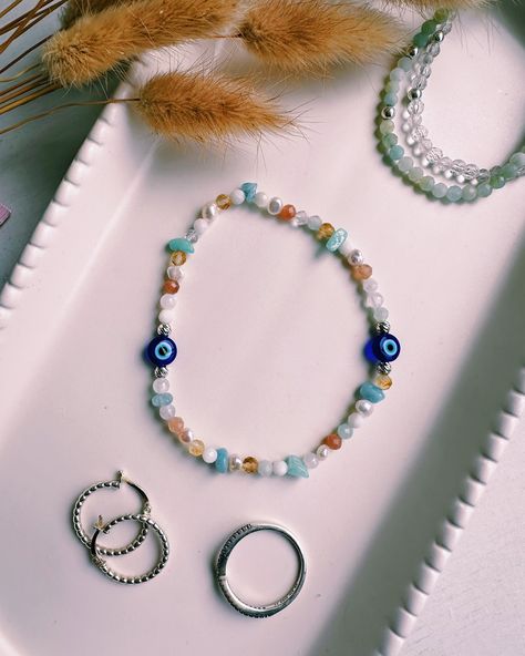 Wearing our summer Santorini bracelet in Autumn/Winter 🧿 The Santorini bracelet was made to evoke all those summer holiday feelings but as we move into autumn and winter you can still call on the healing energies of the crystals that make up this bracelet to support you. ✨ The evil eye 🧿 is always a symbol of protection no matter the season. ✨ Amazonite is the calmest crystal, helping to release stress and tension. ✨ Citrine brings you success and abundance and helps to unlock joy in your ... Fine Jewellery, Summer Holiday, Energy Healing, Santorini, Autumn And Winter, Evil Eye, Citrine, Autumn Winter, Matter