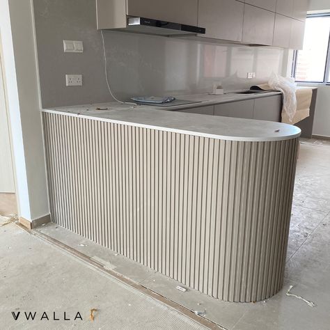 Incorporate calming curves to your kitchen island with rounded edges and pair it with our fluted panels for an elegant look. ✨ Fluted Panel Series: 160 (Slim) Fluted Panel Color: FPS-809 (Taupe) 💬 DM us to obtain our wall coverings catalog ☎️ Hotline: +65 8111 4208 ✉️ Email: hello@vwalla.co 📍 Address: 10 Tampines North Drive 4, #04-06 JTC Space, Singapore 528553 Kitchen Fluted Panel, Fluted Panel Kitchen Cabinets, Fluted Wall Dining Room, Flute Kitchen Cabinets, Fluted Panel Island, Curve Kitchen Island, Fluted Wardrobe Design, Fluted Island Kitchen, Fluted Panel Wardrobe