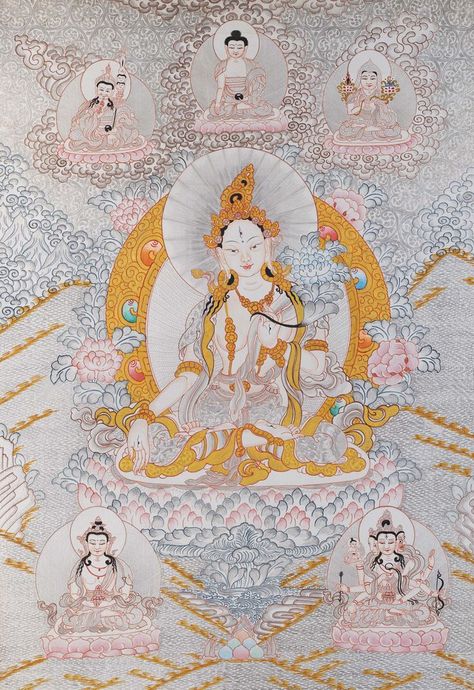 The White Tara or “White Saioress” is said to have born from a tear of the Bodhisattva of compassion. She holds a very prominent position in Tibet. Here White Tara is seen seated on a lotus throne. Her body is white and she is seated in the Vajra posture. Her left hand, which is placed on her heart, holds the stem of a blossoming lotus beside her left shoulder. #Zen Buddhism#Tibetan Thangka#Buddhist Art Tara Goddess, White God, Tibet Art, Guru Rinpoche, White Tara, Ancient Paintings, Thangka Painting, Buddhist Art, White Painting