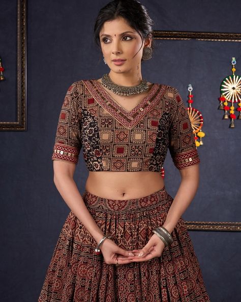 Indulge in the luxurious and exclusive world of fashion with our Elegant Maroon & Black Ajrakh Lehenga. Adorned with intricate Ajrakh print, this stunning lehenga comes with a matching blouse and dupatta, creating a timeless and elegant ensemble. Embrace sophistication and elevate your style with this beautiful piece. #sujatra #sujatraglobal #sujatralehenga #readymadelehenga #stitchedlehengacholi #lehengacholi #ajrakhprints #ajrakhlehenga #lehengalove Ajrakh Lehenga, Ajrakh Dupatta, Ajrakh Prints, Lehenga Choli, World Of Fashion, Lehenga, Elevate Your Style, Return Policy, Size Chart