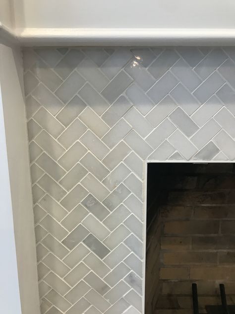 Fireplace Surround Makeover Transitional Fireplace Design Tile, Diy Tile Fireplace Surround, Fireplace Backsplash Ideas, Herringbone Tiles Fireplace, Tiled Fireplace Surround, Tile For Fireplace Surround, Fireplace Surround Tile, Marble Tile Fireplace Surround, Fireplace Remodel Tile