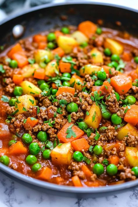 Make authentic Mexican Picadillo at home with this classic recipe! The blend of ground beef, tomatoes, peas, potatoes, and carrots is hearty and delicious. Cowboy Stew With Potatoes And Meatloaf, Healthy Picadillo Recipe, Picadillo Recipe Mexican Authentic, Authentic Mexican Picadillo, Picadillo Con Papas Recipe, Picadillo Recipe Mexican, Ground Beef Picadillo, Turkey Picadillo Recipe, Ground Beef Carrots