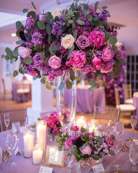 Pink & Purple tall centerpiece with garden & sweetheart roses, peonies. From lilac and lavender to blush and fuchsia on a light purple linen topped with small flower arrangements, pillar candles in glass and gold frame table number. gold chivari ballroom chairs. chic and glamorous photo by Matt Steeves Photography at South Seas Island Resort on Captiva Island, Florida. + save this pin and follow me on instagram Egyptian Tea, Xcaret Wedding, Lilac Theme, Bday Vibes, Ross Williams, Lilac Wedding Bouquet, Purple Wedding Decorations, Quinceanera Planning, Violet Wedding