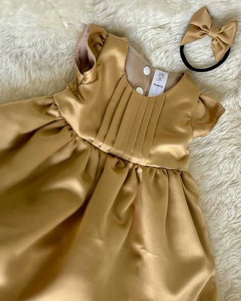 Expertly crafted from high-quality satin, our Alina Dress boasts a beautiful pin tuck bodice and delicate cap sleeves. Fully lined for comfort, this baby dress features a convenient snap closure for easy dressing. Elevate any occasion with this must-have piece. Available in NB - 4T. Pair this dress with any of our hair accessories in a matching fabric to complete the ensemble! Which colour would you like to see this in? Drop a ♥️💙💜🖤💗💛💚🧡 in the comments! #babycouture #FashionableBabies #L... Baby Satin Dress, Box Plate Frock Design For Kids, Newborn Baby Girl Frocks, Silk Baby Dress, New Born Baby Frock Pattern, Baby Girl Frock Design Party Dresses, Six Month Old Baby, 1 Month Baby, Simple Gowns