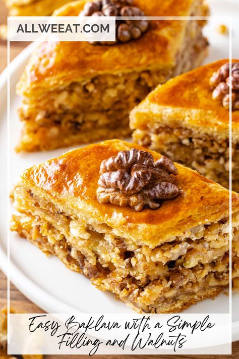 🍯🥮 Treat yourself to this Easy Baklava with a Simple Filling and Walnuts! Layers of flaky phyllo dough, buttery goodness, and a sweet walnut filling, all drizzled with syrup, make this traditional dessert a true delight. Perfect for special occasions or just indulging your sweet tooth, this homemade baklava is easier than you think! 🌟 #BaklavaRecipe #EasyDesserts #WalnutBaklava #PhylloPastry #SweetTreats #HomemadeDessert #MiddleEasternDessert Traditional Baklava Recipe, Easy Baklava, Homemade Baklava, Baklava Recipe Easy, Brie Puff Pastry, Middle Eastern Desserts, Baklava Recipe, Puff Pastry Tart, Honey Walnut