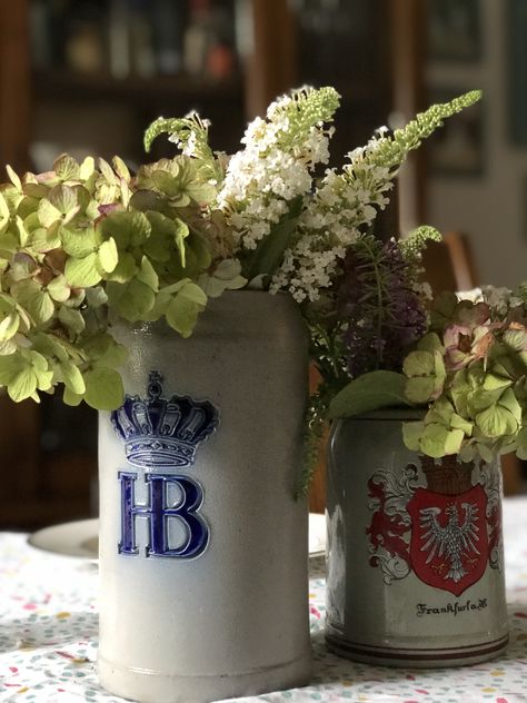 #beerstein #centerpiece #fordad | Joy in the Midst Creative Beer Stein Flower Arrangements, German Wedding Decorations, Oktoberfest Floral Arrangements, Beer Stein Centerpiece, Octoberfest Party Decorations, Oktoberfest Centerpieces, Beer Garden Wedding, Oktoberfest Table, Oktoberfest Wedding