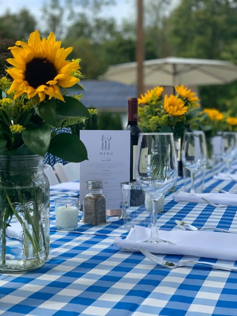 Sunflowers, blue and white checkered tablecloths, wine, Summer, early Fall, DIY Blue Gingham Picnic Party, Blue Checkered Tablecloth, Blue And White Bbq Decor, Lemon And Blue Gingham Party, Blue Checkered Tablecloth Table Settings, Blue And White Picnic Theme, Blue Gingham Party Decor, Blue Gingham Table Setting, Picnic Rehearsal Dinner Ideas