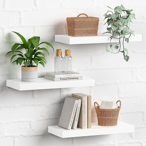 Super cute but simple white floating shelves. Perfect for plants or decor! #bedroom #simpleaesthetic #decor #ad #affiliatemarketing #igetpaid Bookshelf Bedroom Ideas, Floating Bookshelves Bedroom, Bedroom Books, Bookshelves For Small Spaces, Shelves For Bedroom, Long Floating Shelves, Floating Bookshelves, Wall Mounted Bookshelves, White Floating Shelves