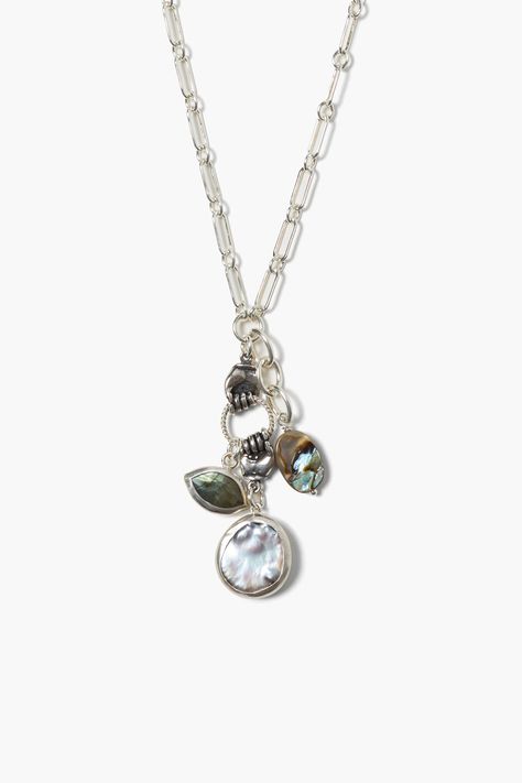 A luminous peacock pearl coin anchors this sterling silver charm necklace featuring a silver wrapped labradorite marquise stone and abalone oval connected by two grasping hand charms.Sterling silver.17 - 19" adjustable.Handmade in Vietnam. Sterling Silver Charm Necklace, Jewelry 2023, Silver Charm Necklace, Gold Horns, Peacock Pearl, Well Traveled, Charm Necklace Silver, Pink Necklace, Making Things