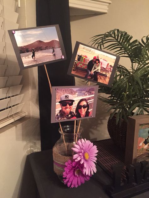 Made these for table centerpieces at my "By the beach wedding!" Double sided pictures, used hot glue gun and card stock paper! I printed 12 photos at Walmart for under $4 and used $1 store materials to decorate the vase! Total project for two approx $12 with extra materials left over. Vase With Pictures Centerpieces, Centerpieces With Photos In Them, Photo Centre Piece Ideas, Picture Cube Centerpiece, Photo Frame Centerpiece Ideas, Photo Vase Centerpiece, Table Top Photo Display, Wedding Centerpieces With Photos, Table Centerpieces With Pictures