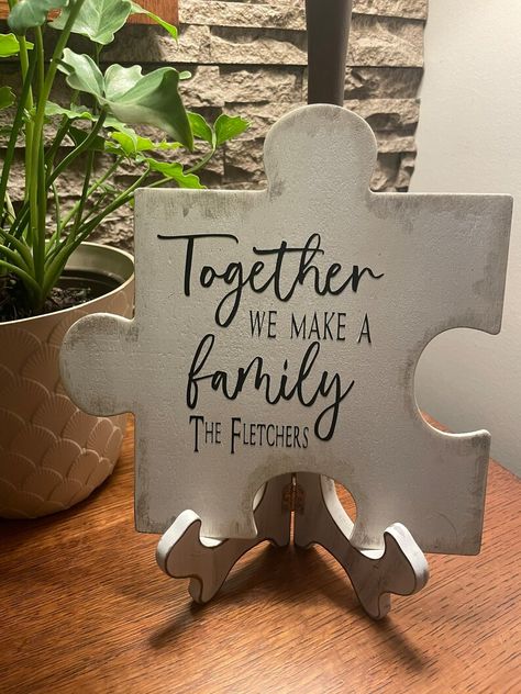 Our Personalized Puzzle Piece Name Sign makes the cutest addition to your family gallery wall tying it all together. 

You can personalize it with your Last name or leave it with just the simple quote; the choice is yours. Wooden Puzzle Pieces Crafts, Puzzle Piece Decorations, Puzzle Piece Centerpiece Ideas, Puzzle Pieces Quotes, Diy Alphabet Letters, Glowforge Aura, Puzzle Theme, Puzzle Piece Art, Puzzle Piece Crafts