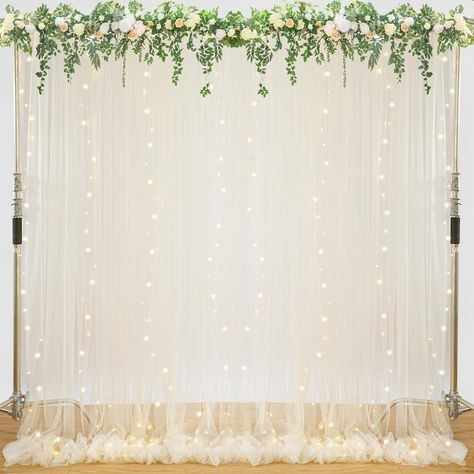 PRICES MAY VARY. Package: Includes 2 panels 5ft width by 10ft height tulle backdrop curtains, a set of 9.8ft warm white lights string and 12 pcs transparent clips. Easy to Install: The sheer tulle curtain has a 4-inch rod pocket at the top for easy hanging. Light strings can be hung with transparent clips to prevent tangles.It can be used on both sides. Elegant Sheer Draping Fabric: The backdrop curtain are crafted from soft and smooth tulle. Flowing loosely onto the floor, add a very soft, beau Tulle Backdrop With Lights, Neutral Photo Backdrop, Backdrop With Drapes, Drapes For Party, Pavilion Wedding Decorations, Backdrop With Lights, Wedding Curtains, Bridal Shower Photo Booth, Lights For Party