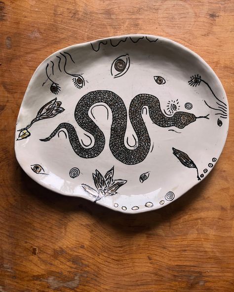 Some fun new platters swipe right to see the snake! #platters #pottery #potterylove #handmadeplatter #homedecor #interiordesign #home #homedecorideas #handmadepottery #potteryart #art #ceramic #snake #bird #swallows #swan Snake Ceramics, Snake Paintings, Painting Pottery Plates, Ceramic Snake, Snake Painting, Painting Pottery, Painted Ceramics, Ceramic Ashtray, Pottery Inspiration