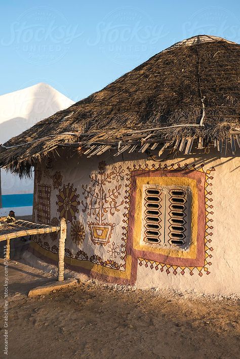 Traditional Circular Kutch Tribal Huts Traditionally painted circular house-form (bhunga) made with mud in Kutch district, Gujarat, India  / Alexander Grabchilev for Stocksy United African Hut, Mud Hut, Hut House, Casa Cook, African House, Mud House, Rural Living, Indian Village, Cob House