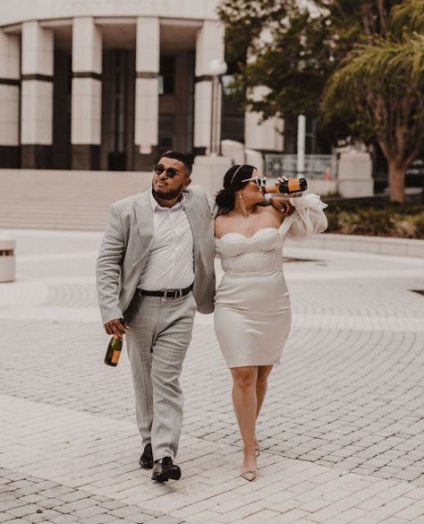 a newly married couple drinking champagne in front of the courthouse Champagne Spray, Lawyers Day, The Audacity, Lawyer Fashion, Downtown Orlando, Boda Mexicana, Wedding Court, Future Wedding Plans, Courthouse Wedding