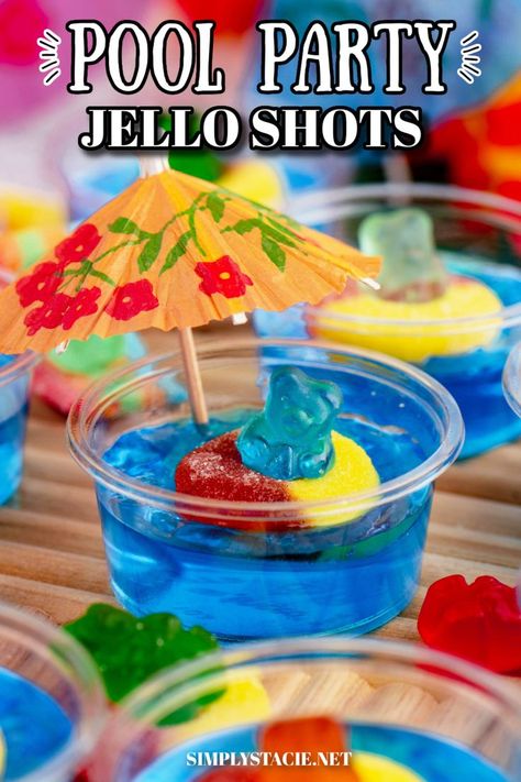 A pool party jello shot with a decorative umbrella. Pool Party Jello Shots, Birthday Jello Shots, Jello Shots With Vodka, Party Jello Shots, Shots With Vodka, Summer Jello Shots, Shark Week Drinks, Gummy Bear Drink, Alcohol Jello Shots