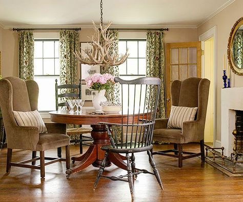 Even more formal spaces, such as a den or dining room, flourish with versatile English cottage style, which blends elegance with a relaxed attitude. High-backed chairs, both wooden and upholstered, are prim but well-worn in this dining room. A chandelier sprouts with antlers rather than crystals, a nod to countryside hunting./ Dining Room Decorating Ideas, English Cottage Interiors, Dining Room Decorating, Cottage Dining, Cottage Dining Rooms, English Cottage Decor, Cottage Room, Country Dining Rooms, English Cottage Style