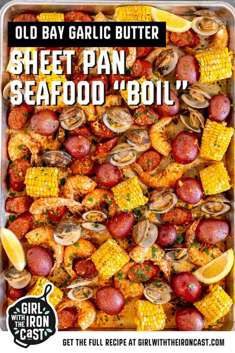 Nothing captures the essence of summer like a clambake or seafood boil! This recipe simplifies the process by roasting juicy shrimp, briny clams, spicy andouille sausage, corn on the cob, and baby potatoes, tossed in an Old Bay butter sauce on a sheet pan in the oven. Serve family style, start peeling, and enjoy a tender, succulent seafood dinner. Seafood Broil In Oven, Pan Seafood Boil, Seafood Boil Recipes Cajun, Shrimp Boil In Oven, Crab Boil Recipe, Cajun Shrimp Boil, Seafood Cuisine, Seafood Broil, Shrimp And Crab Boil