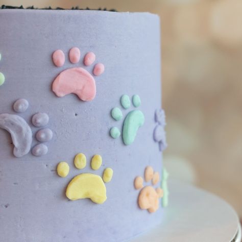 A pastel rainbow of puppy paw prints on a subtle lavender background gives this gluten-free cake the fun personality requested by the birthday girl. Puppy Themed Birthday Cake, Paw Print Cake, Paw Print Cakes, Brooklyn Nicole, Paw Birthday, Dog Themed Parties, Lavender Background, Puppy Paw Prints, Puppy Paw