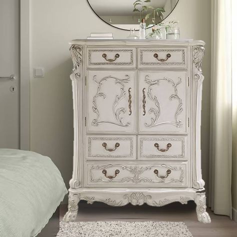 Elegant yet lightheartedly playful, Dresden is donned in an amiable antique white finish with hand-applied burnish over the many layers of stains and finishes that are manually rubbed on, providing depth and character to this classic group. The Rococo style is candidly represented in the classic ornamental features of Dresden, with the carefully chosen hardwood veneer inlaid, plentiful decorative carvings, and ample sizes worthy of a master bedroom. White Antique Dresser, Antique Decor Bedroom, Decorative Storage Cabinets, Shabby Chic Bedroom Furniture, Rococo Furniture, Antique Bedroom, Wood Composite, Cute Bedroom Decor, Acme Furniture