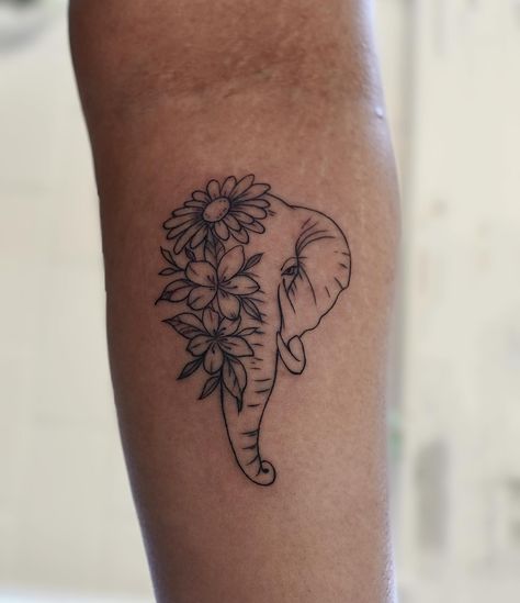 Grace and strength intertwine in this beautiful elephant tattoo adorned with delicate flowers. A symbol of wisdom, resilience, and the beauty that blooms from within By @carbonoidtattoos ‼️To book and appointment or consultation please visit our website, call or email ✏️🗒️ 💻 https://www.myinktattoo.ca/book 📲 +1 (416) 581-8888 📲 studio@myinktattoo.ca #tattoo #tattooer #tattooart #tattooideas #tattooartist #tattoo2me #firsttattoo #finelinetattoo #fineline #elephant #elephanttattoo #elephan... Feminine Elephant Tattoo, Elephant Ears Tattoo, Elegant Elephant Tattoos, Elephant Flower Tattoo, Abstract Elephant Tattoo, Motherhood Tattoos Elephant, Elephant Fine Line Tattoo, Elephant Flower Tattoo Design, Elephant Tattoos With Flowers