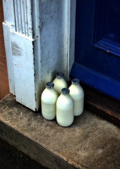 Four bottles of milk waiting on a doorstep in suburban London | Phil Ostroff Front Doorstep, Old Milk Bottles, Lighting Mood, Milk Delivery, Milk Man, 1930s House, House Essentials, Mood Colors, Milk Bottles