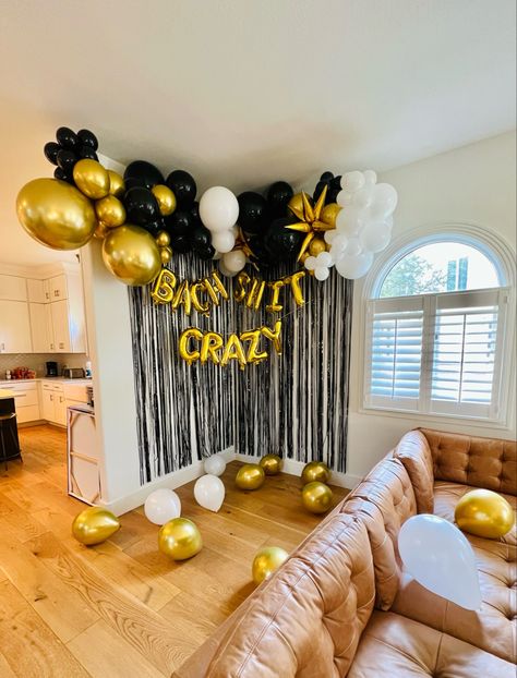 Gold, white and black balloon garland with Bach shit crazy gold letter balloons and a black tinsel curtain, installed in an Airbnb in Austin Texas Black And Gold Bachelorette Party Decor, Black And White Bachelorette Theme, Balloon Arch Bachelorette, Black And Gold Bachelorette Party, Black And White Balloon Arch, Bachlorette Party Decorations, White Balloon Arch, Gold Bachelorette Party Decorations, Austin Bachelorette Party