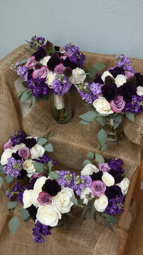 Bride and bridesmaids bouquets of white and purple roses, lavender and purple stock and dark purple carnations with accents of seeded eucalyptus. Light And Dark Purple Wedding, Purple October Wedding, Prom Bouquet Ideas Purple, Purple Flower Combinations, Dark Purple Wedding Bouquets, Purple Rustic Wedding Decor, Purple Prom Flowers, Plum And Navy Wedding Flowers, Purple Centerpiece Wedding