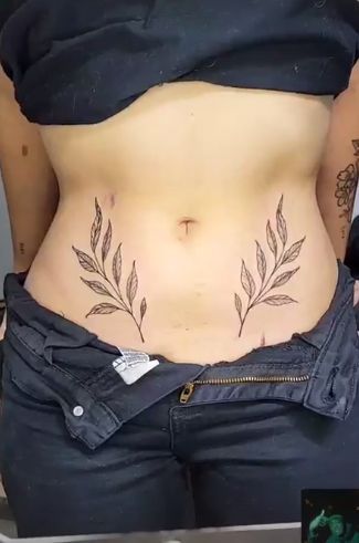 Hip Leaf Tattoos Women, Small Belly Button Tattoos For Women, Belly And Hip Tattoos, Leaves Stomach Tattoo, Tattoo Tummy Lower Stomach, Leaves On Hip Tattoo, Leaf Stomach Tattoo, Hip Leaf Tattoo, Plant Stomach Tattoo