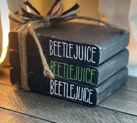 Cricut Book Stack, Beetle Juice Craft Ideas, Beetlejuice Decorations Diy Crafts, Halloween Stacked Books, Beetlejuice Beetlejuice Beetlejuice, Beetlejuice Crafts Diy, Diy Halloween Signs Wood, Halloween Book Stacks, Beetlejuice Crafts