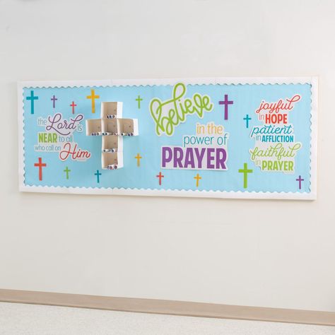 This interactive and faith-filled bulletin board set is a bright and colorful addition to a Sunday School classroom or home learning space. Help kids learn about the power of prayer with this fun bulletin board set! Kids write prayers on the included sheets of paper and then roll up the paper to fill the boxes of the cross. Cardstock. (40 pcs. per set) Sheets, 16" x 24 1/2" Includes four sheets, six boxes and 30 paper sheets. © OTC Religion Classroom Decor, Classroom Prayer Wall, Bible Verse For Classroom Bulletin Boards, Cross Bulletin Board, Prayer Board Supplies, Jesus Bulletin Boards, Christian School Bulletin Boards, Sunday School Classroom Decor, Religious Bulletin Boards