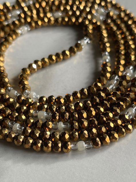 WEALTH CRYSTAL WAIST BEAD👑 Includes bronze/gold crystal beads with a clear and pearl bead accent. Available now on our site! Be sure to add our DIY Screw-on Kit to make them removable. #wealth #gold #crystals #crystalbeads #chicserenity African Waist Beads, Gold Crystals, Waist Beads, Bronze Gold, Gold Crystal, Pearl Beads, Crystal Beads, Screw, Active Wear