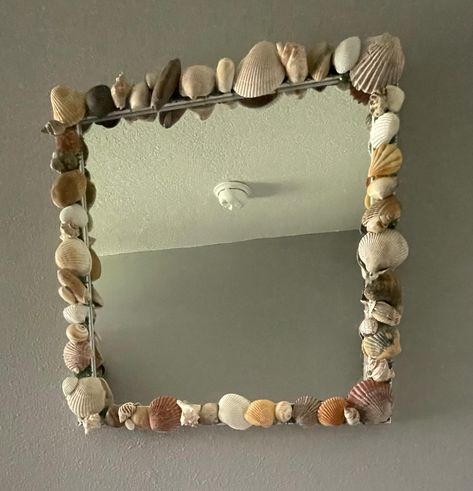 Sea Shell Mirror Bring the Beach Home with Our Sea Shell Frame Mirror Our sea shell mirrors are a delightful way to add a touch of the coast to your décor. Each frame is adorned with a carefully arranged collection of sea shells, capturing the essence of the shore with every detail. Perfect for beach house décor or as a thoughtful gift for a loved one, these frames offer a charming way to remember your seaside adventures. Sea Shell Mirrors, Sea Shell Mirror, Shell Mirrors, Seashell Mirror, Mirror Frame Diy, Shell Mirror, Shell Frame, Winter Park Fl, Frame Mirror