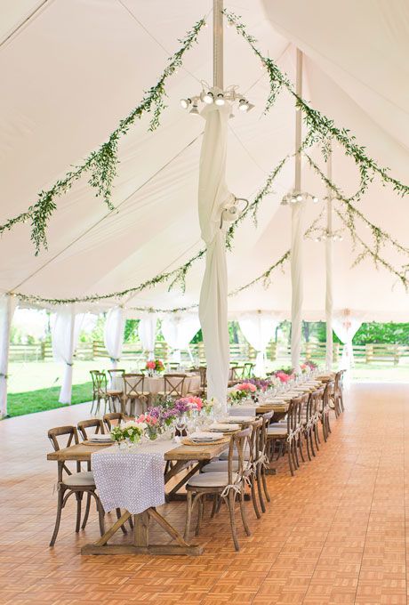 Beautiful Wedding Tent Ideas: Hanging Greenery Garlands | Brides.com Wedding Tent Decorations, Michigan Wedding Venues, Yosemite Wedding, Tent Decorations, Wedding Tent, Outdoor Wedding Reception, Marquee Wedding, Tent Wedding, Michigan Wedding