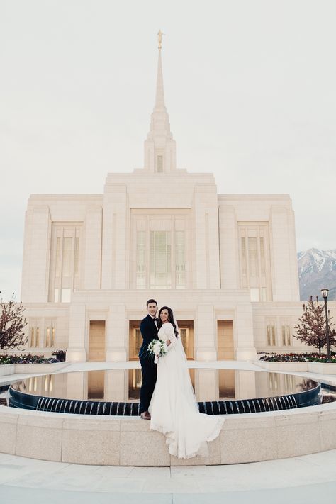 alice shoots people, ogden utah temple, ogden wedding, ogden utah temple wedding, utah wedding photographer, modest wedding gown, long sleeve lace wedding dress, bride with long veil, tunnel springs park wedding photos, bride and groom, groom in navy suit, bride and groom pose ideas, bountiful tunnel springs park, bride and groom with dark hair, gold doors, homemade wedding bouquet Laie Temple Wedding, Ogden Temple Wedding, Lds Temple Wedding Pictures, Dark Academia Wedding, Temple Wedding Pictures, Ogden Temple, Logan Utah Temple Wedding, Mt Timpanogos Temple Wedding, Temple Wedding Photos