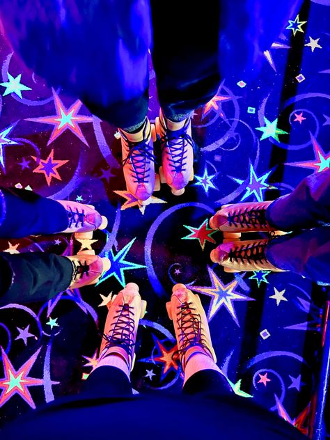 neon roller skates in roller rink Roller Rink Aesthetic Vintage, Rainbow Rider Skates, 80s Aesthetic Roller Skates, Neon Disco Aesthetic, 90s Roller Skating Aesthetic, Neon Roller Skates, Neon Roller Rink, Neon 70s Aesthetic, Star Roller Skates