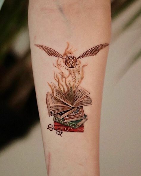 Golden Snitch Tattoo, Snitch Tattoo, Harry Potter Tattoo Sleeve, Book Inspired Tattoos, Dark Mark Tattoos, Pixie Tattoo, Hogwarts Tattoo, Books Tattoo, Sewing Tattoos