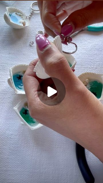 Gurpreet | Resin artistry on Instagram: "“Dive into the Creative Process: Witness the mesmerizing journey of crafting our ocean-inspired seashell keychains. 🐚✨ From resin pouring to delicate finishing touches, each piece is infused with coastal charm. 🌊 #BehindTheScenes #OceanDesign #HandcraftedMagic #SeashellKeychains #ArtisanCrafts”" Resin Seashell Crafts, Diy Resin Keychain, Resin Pouring, Diy Resin Projects, Ocean Design, Resin Pour, Resin Keychain, Coastal Charm, The Creative Process