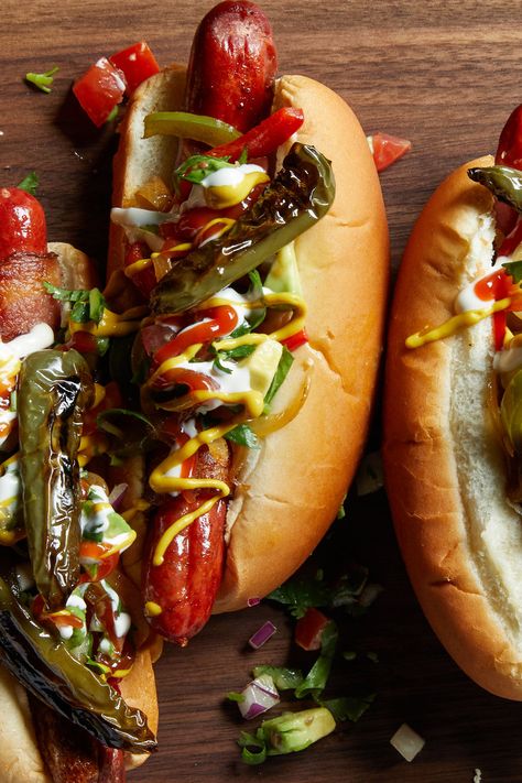 Mexican Hot Dogs Recipe - NYT Cooking Mexican Hot Dogs Recipes, Mexican Hot Dogs, Sautéed Peppers, Hot Dog Recipe, Bacon Wrapped Hotdogs, Wrapped Hot Dogs, Dog Restaurant, Sauteed Peppers, Fingerfood Party