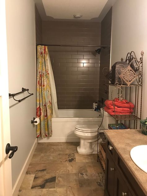 This simple trick will make your bathroom feel much bigger! from Thrifty Decor Chick Shower Curtain Hung High, Where To Hang Shower Curtain Rod, Shower Curtain Hung From Ceiling, 10 Foot Shower Curtain, Shower Curtain Ceiling To Floor, High Curtain Bathroom, Ceiling High Shower Curtain, How High To Hang Shower Curtain Rod, Shower Curtain To The Ceiling