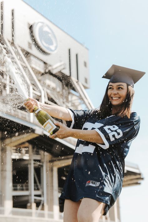 Penn State Grad Popping Champagne in front of Beaver Stadium Penn State Senior Pictures, Penn State Graduation Pictures, Penn State Graduation, Penn State College, Popping Champagne, Graduation Pic Ideas, Beaver Stadium, Graduation Pic, College Graduation Pictures