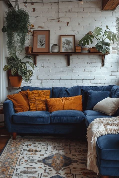 Navy Sofa Living Room Curtains, Blue Couch Living Room Ideas Boho, Boho Blue Couch, Vibrant House Decor, Blue Boho Living Room Inspiration, Peacock Blue Couch Living Room, Navy Couch Styling, Navy Couch Decor, Boho Couch Ideas