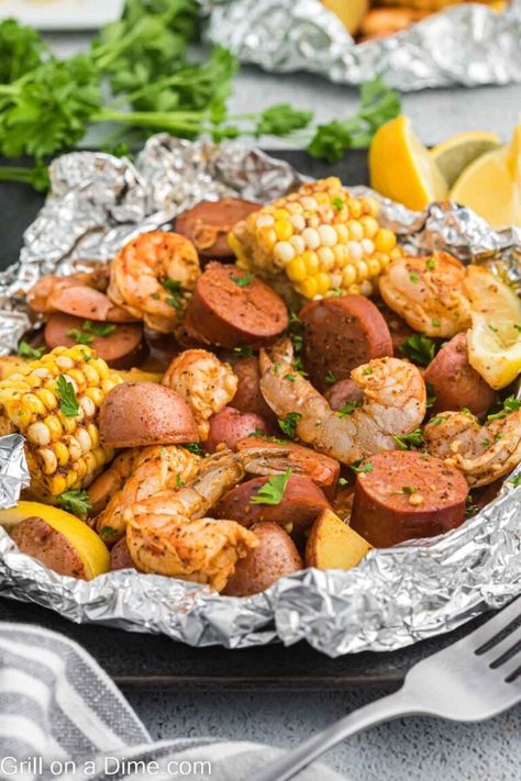 Shrimp Boil Foil Pack Recipe - grillonadime.com Shrimp Boil Foil Packs, Shrimp Boil Foil, Sausage And Veggies, Recipe Shrimp, Foil Pack Meals, Shrimp Sausage, Foil Packet, Delicious Seafood Recipes, Seafood Recipe