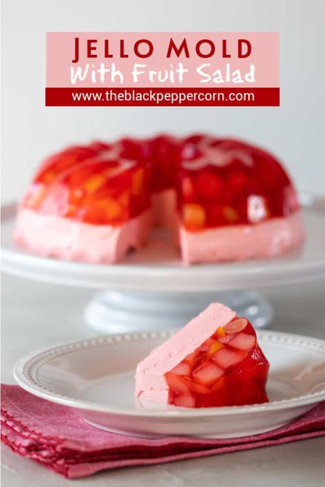 Jello Mold with Fruit Salad Recipe - The Black Peppercorn - This classic retro recipe is perfect for pot lucks, holidays, parties and more! A simple recipe with Strawberry jello, fruit salad from a can and cool whip. Jello Recipes With Cool Whip, Jello Fruit Salad, Jello Fruit, Jello Fruit Salads, Jelly Salad, Jello With Fruit, Recipes With Cool Whip, Jello Mold Recipes, Cool Whip Desserts