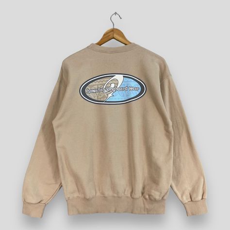 Vintage 1990s PIKO Crewneck Sweatshirt Medium Piko Hawaiian Longboard Surfing Beach Jumper Piko Longboard Surfwear Beige Sweater Size M *All measurements are taken with the garment flat on the ground. SIZE ON TAG :- Size M ACTUAL SIZE MEASUREMENT :- ARM PIT TO ARM PIT :- 20.5" inches BACK COLLAR TO HEM :- 26" inches CONDITION :- GREAT USED CONDITION. HAS A PINHOLE (KINDLY REFER TO THE PICTURES ATTACHED) REF : (23-10-2023) R103 Longboard Surfing, Beach Jumper, Beige Pullover, Surf Design, My Pleasure, Surf Wear, Beige Sweater, Used Clothing, Design Inspo