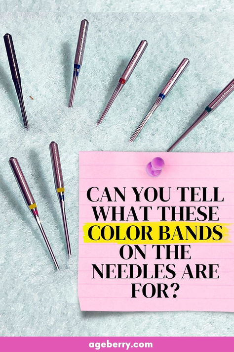 Close-up of Schmetz sewing machine needles arranged on a textured background, each with visible color bands indicating their type. A pink notepad with bold text asks, "Can you tell what these color bands on the needles are for?" Perfect for understanding needle types and color codes. Machine Embroidery Needles Guide, Types Of Quilting Techniques, Sewing Machine Needle Storage, Sewing Machine Needle Chart, Sewing Machine Needle Guide, Janome Sewing Machine Tutorials, Cleaning Fruit, Sewing Needle Sizes, Sewing Guide