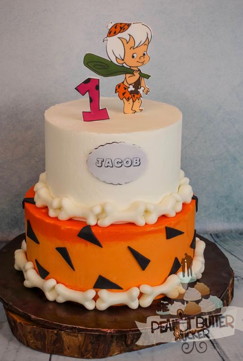 Flinstones bambam 2 tier birthday cake Flinstones Birthday Cake Bam Bam, Flintstone Cake Ideas, Flintstone 1st Birthday Party, Flinstones Birthday Party Ideas, Bam Bam Birthday Cake, Flintstone Birthday Cake, Flintstones Birthday Cake, Yabba Dabba Doo Birthday, Bambam Birthday Party Ideas