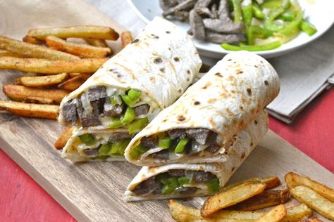 Philly cheese steak wrap by Maebells is a quick and portable take on the traditional cheese steak sandwich. You can make this complete meal in less than an hour knowing full well each wrap delivers... Steak Wraps, Cheesesteak Recipe, Cheese Steak Sandwich, Protein Packed Meals, Cheese Steak, Philly Cheese, Steak Sandwich, Steak Recipe, Club Sandwich